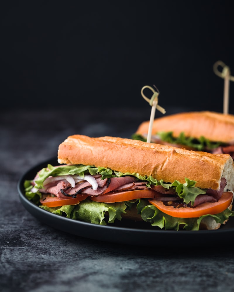 A fresh sub sandwich stacked generously with deli meats and vegetables